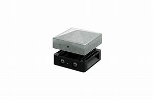 Grey concrete block resting on black electronic device